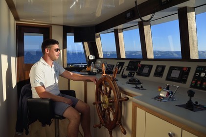 Croatia, Dalmatia, cruise ship Ave Maria and its captain Rade Naranca in the wheelhouse