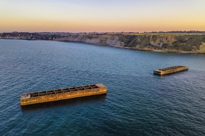 France, Calvados, Arromanches les Bains, cliffs of Cap Manvieux, Mulberry B remains, Port Winston, Phoenix breakwaters (aerial view)