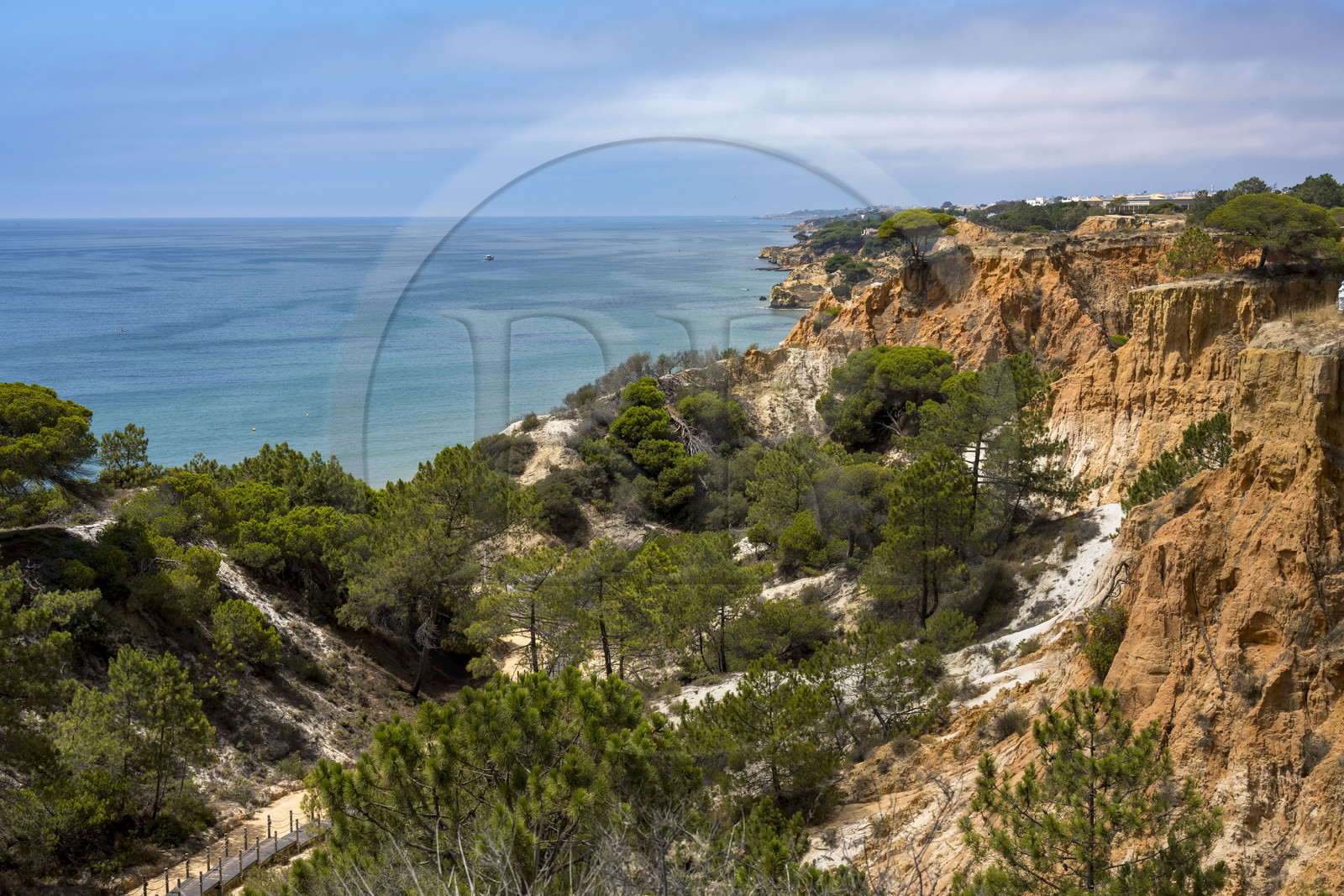 Portugal, Algarve, Olhos de Agua, the beach of Praia da Falésia overlooked by its red cliffs