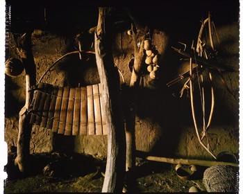 Burkina Faso, Poni province, Lobi land, Loropéni region, Lacar, house entrance of the Lakar village chief with a balafon (ritual) suspended as well as bows and arrows which always have to be at hand even in time of peace