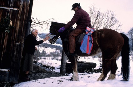 Switzerland, region of Bern (Bernese Oberland), Saanenland, Gstaad, the postman riding a horse giving the post