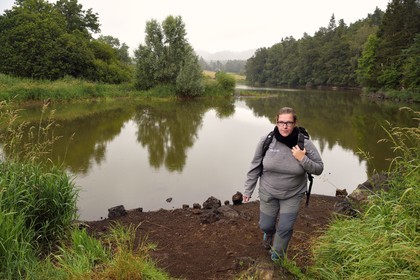 France, Puy de Dome, Aydat, towards the pond of Chateau de Montlosier, Catline Lajoie nature warden at the Parc Naturel Régional des Volcans d'Auvergne (regional nature park of Auvergne volcanoes)