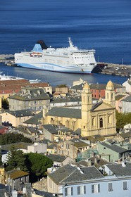 France, Haute Corse, Bastia, St Jean Baptiste Church and the commercial harbor in the background