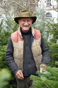France, Bas Rhin, Strasbourg, old town listed as World Heritage by UNESCO, Christmas market (Christkindelsmarik) in Place Broglie, Daniel Bailly sells fir trees for the Schwoob family, established on the Christmas market for many years