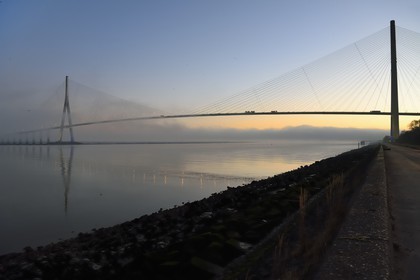 France, between  Calvados and Seine Maritime, the Pont de Normandie (Normandy Bridge) in the mists of dawn, it spans the Seine to connect the towns of Honfleur and Le Havre
