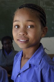 Namibia, Erongo region, Damaraland, the Spitzkoppe in the Namib Desert, Katora Primary School, young girl in the grade 4 classroom (around 11 years)