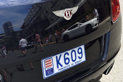 Principality of Monaco, Monaco, Monte-Carlo, the Hotel de Paris is reflected in the bodywork of a Bentley