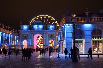 France, Meurthe-et-Moselle, Nancy, place Stanislas (former Place Royale) during the feast of Saint-Nicolas, listed as World Heritage by UNESCO, the Arc de Triomphe (Porte Héré) and the Ferris wheel in the background