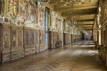 France, Seine-et-Marne, Fontainebleau, castle of Fontainebleau listed as World Heritage by UNESCO, the Francois 1er Gallery built between 1528 and 1530, decorated with paintings, paneling, frescoes and stuccos, carved walnut woodwork and a coffered ceiling