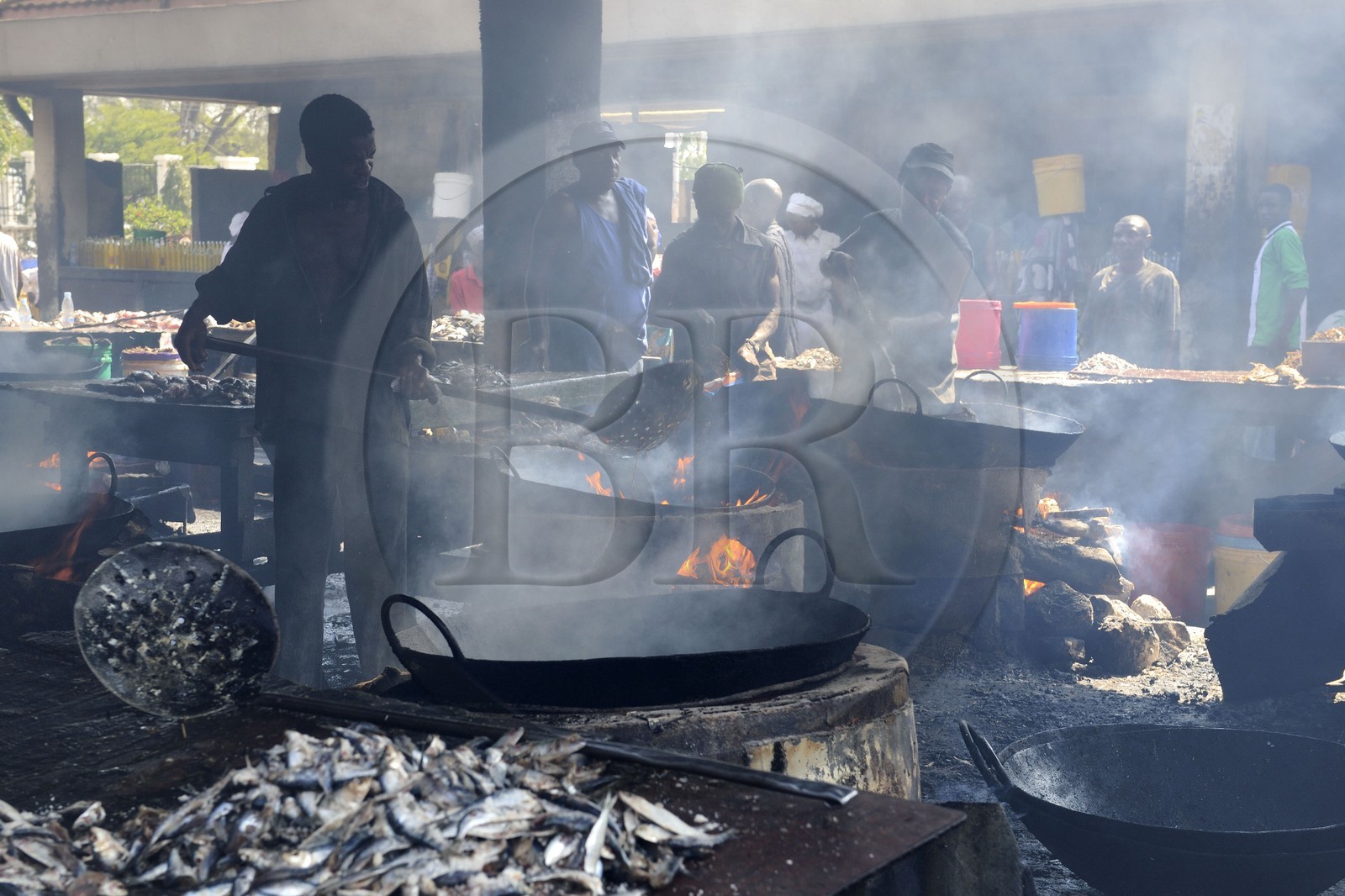 Tanzania, Dar es-Salaam, Kivukoni fish market, the fish is fried in metal bowls filled with plenty of oil before selling it around town