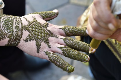 Morocco, High Atlas, Marrakech, Imperial city, Medina listed as World Heritage by UNESCO, Jemaa El Fna square, henna tattoos on a hand