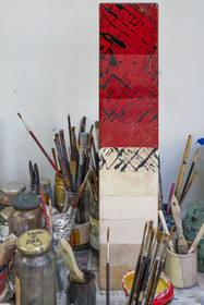 France, Hauts-de-Seine, Colombes, the french artist and lacquerer Isabelle Emmerique in her studio, panel presenting the different stages of lacquering up to 40 layers (top)