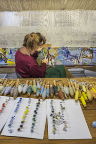 France, Herault, Lodève, Manufacture de la Savonnerie (Savonnerie manufactory) unique annex of the National Carpet Factory of the Savonnerie des Gobelins in Paris, realization by the weaver Kristell Corbinais on a loom of a seat tapestry for the bench L'Iris dans la vallée designed by Philippe Borderieux, mowing action