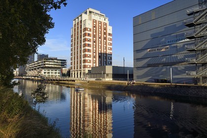 France, Bas Rhin, Strasbourg, development of port du Rhin (Rhine's harbour) and conversion of breakwater of Bassin d'Austerlitz, the Malraux peninsula, former 47m Mole Seegmuller grain silo converted into a university residence and the Andre Malraux media library on the edge of the Austerlitz basin