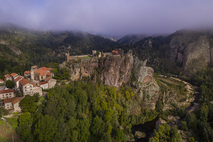 France, Haute Loire, Loire river Valley, Arlempdes, labelized the Most Beautiful Villages of France, ruins of the castle perched on a basalt rock (volcanic dyke) overlooking a Loire river meander (aerial view)