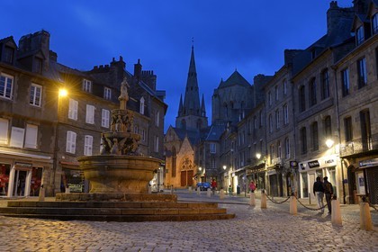 France, Cotes-d'Armor, Guingamp, the Plomee Fountain in the place du Centre and the Notre Dame street leading to the Basilica of Notre Dame de Bon secours