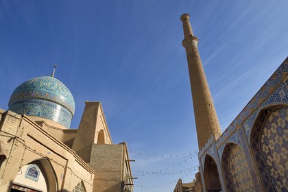 Iran, Isfahan Province, Isfahan, Haroonieh mosque left and the minaret of the Ali mosque right