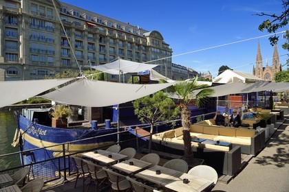 France, Bas Rhin, Strasbourg, Neustadt district dating from the German period listed as World Heritage by UNESCO, Café barges along the Quai des Pecheurs on the banks of the River Ill and the Saint-Paul Protestant Church in the background