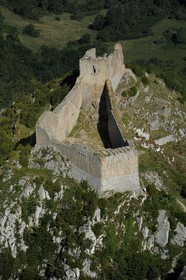 France, Ariege, Pays d' Olmes, Cathar Castle of Montsegur perched on a rock and the Pyrenees (aerial view)..