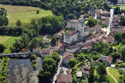 France, Dordogne, Perigord Vert, Bourdeilles, the castle overlooking the village and the Dronne river (aerial view)