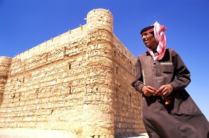 Jordan, guardian of 8th century Qasr Kharaneh or Castle of the Desert