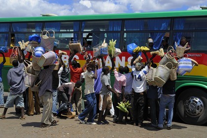 Tanzania, Morogoro, the bus terminal, small vendors assaults at a bus stop