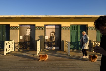 France, Calvados, Pays d'Auge, Deauville, the famous planks on the beach, lined with Art Deco style bathing cabins, tribute to Monet and Renoir