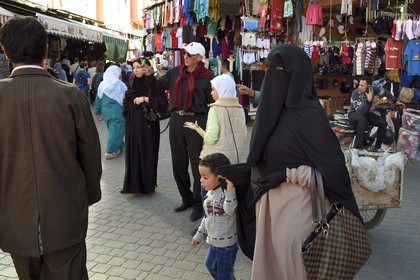 Morocco, High Atlas, Marrakech, Imperial city, Medina listed as World Heritage by UNESCO, veiled woman in the souk
