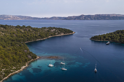Croatia, Dalmatia, Dalmatian coast, Island of Mljet, National Park of Mljet, anchorage of sailboats in the bay of Polace (aerial view)