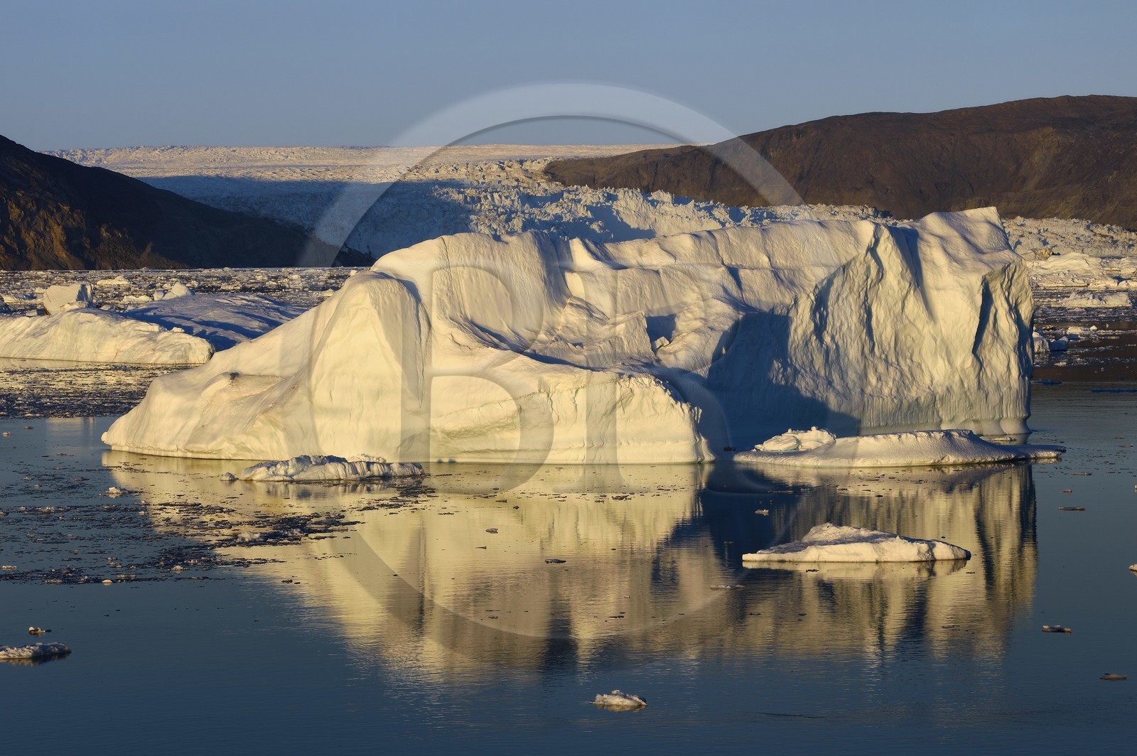 Greenland, west coast, Disko Bay, Icebergs in Quervain Bay at sunset and the Eqip Sermia Glacier (Eqi Glacier) in the background