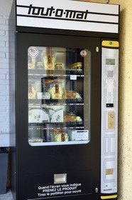 Switzerland, Canton of Vaud, Aigle, fondue machine which is a self-service distributor of cheeses and fondues