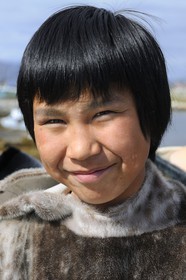 Greenland, city of Nanortalik, Inuit young boy wearing traditional clothes made of seal skin