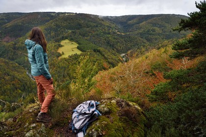 France, Ardeche, parc naturel regional des Monts d'Ardeche (Regional natural reserve of the Mounts of Ardeche), Mezenc Massif, Lac d'Issarles forest, Rang Goutier belvedere at the top of Montchamp, hiker at the panoramic viewpoint over the Loire Valley