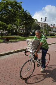 Panama, Panama City, historic town listed as World Heritage by UNESCO, Casco Antiguo (Viejo), newspaper deliveryman on plaza Tomas Herrera