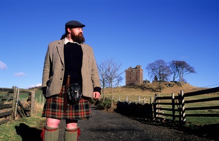 United Kingdom, Scotland, Perthshire and Kinross, Balvaird Castle and its owner wearing the traditional kilt