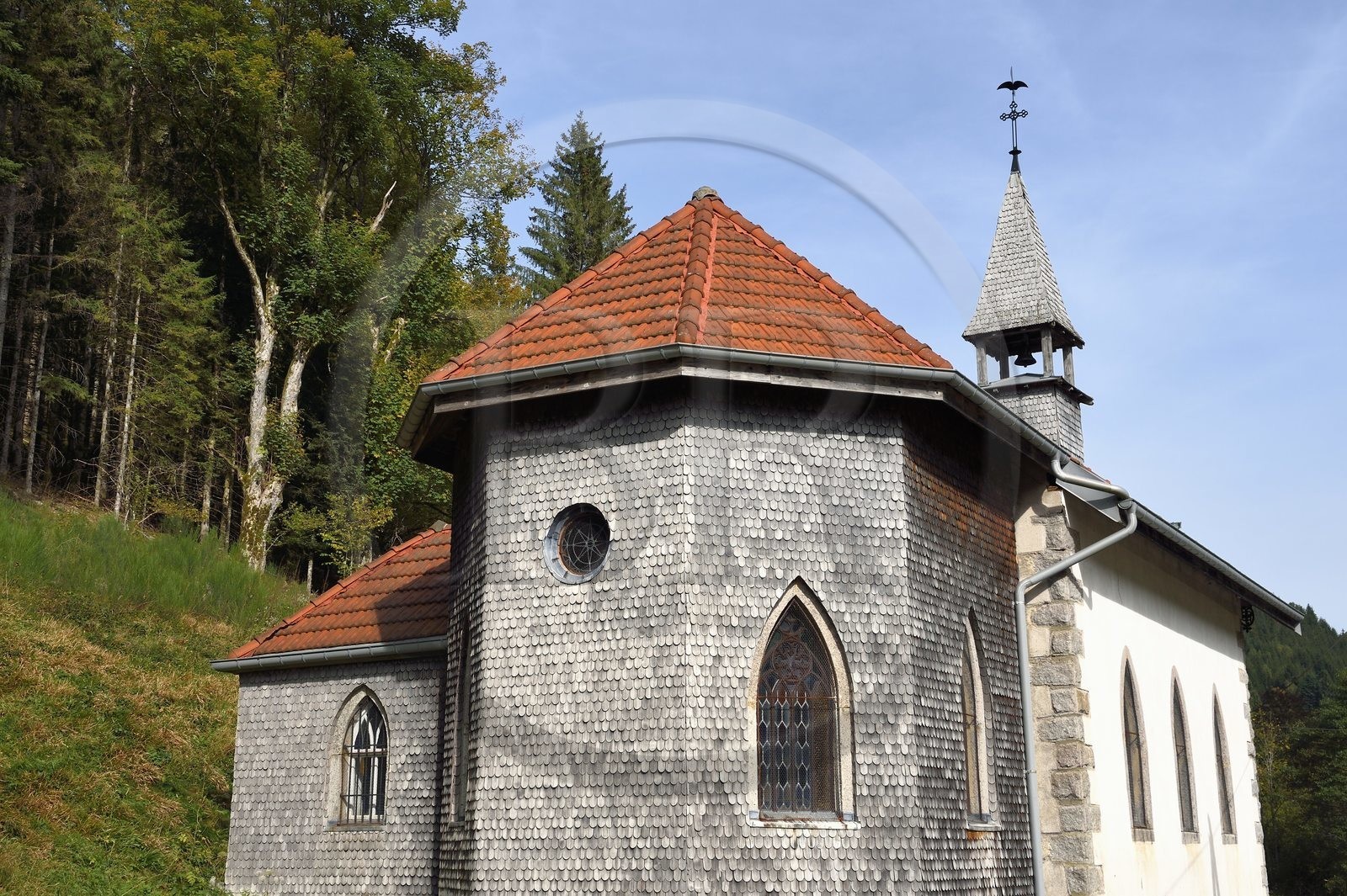 France, Vosges, Le Valtin, village in the upper valley of the Meurthe, Rudlin's Chapel with a tetra rooster in a weather vane, facade covered with shingles or wooden slats used for protection against bad weather