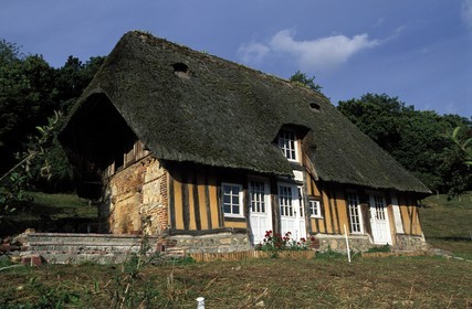 France, Eure, Bec Hellouin, labelled Les Plus Beaux Villages de France (The Most Beautiful Villages of France), a traditional Norman thatched roof cottage