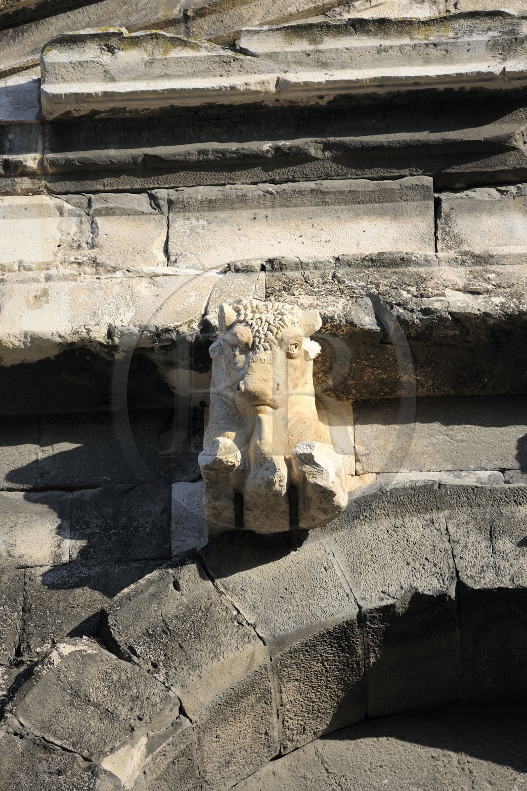 France, Gard, Nimes, the arenas, pediment ornamented with bulls over the main of the four axial gates France, Gard, Nimes, the arenas, pediment ornamented with bulls over the main of the four axial gates