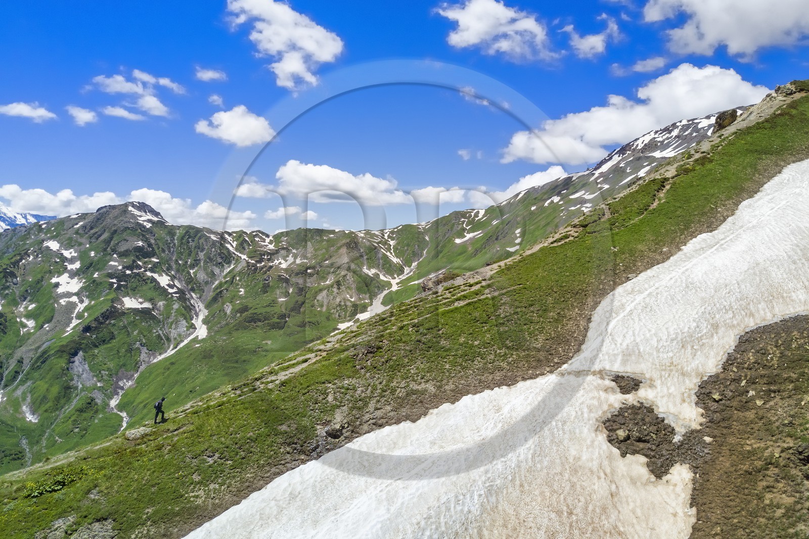 Georgia, Upper Svaneti (Zemo Svaneti), Mestia, hiker on the foothills of Mount Ushba going to Guli pass (aerial view)
