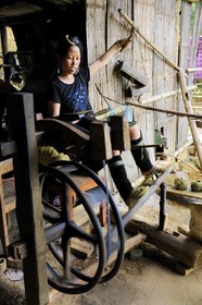 Vietnam, Lao Cai province, Sapa district, woman from the Black Hmong minority group in her weaving workshop