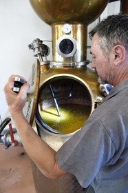 France, Reunion island (French overseas department), La Saline, La Part des Anges Distillation, filling the electric still with the fermented pineapple for the triple distillation of eau de vie (brandy)