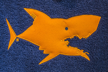 France, Côtes-d'Armor, Tréguier, iconic drawing of the shark from the creative brand Je dévore ma Bretagne in the mouth of which we find the map of Brittany
