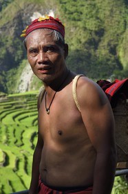 Philippines, Ifugao province, Banaue rice terraces around the village of Batad, listed as World Heritage by UNESCO, the guide Adolpho coated in the traditional Ifugao costume
