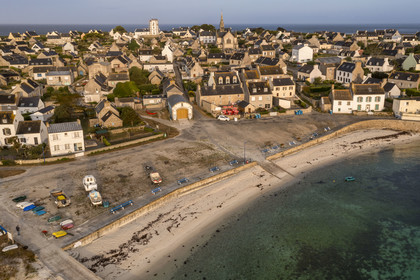 France, Finistère, Iroise Sea, Molene archipelago, Molene Island, the port beach, the shelter of the old rowing lifeboat, the semaphore and the Saint-Ronan church in the early morning (aerial view)
