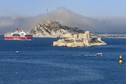 France, Bouches du Rhone, Marseille, Calanques National Park, archipelago of Frioul islands, Corsica Linea Ferry arriving from Corsica and the Chateau d'If in the foreground