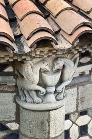 France, Puy de Dome, Clermont Ferrand, Notre-Dame-du-Port basilica in Auvergne Romanesque style, listed as a UNESCO World Heritage Site under the Routes of Saint-Jacques-de-Compostelle in France, apse of the church, capital representing two griffins around a cup