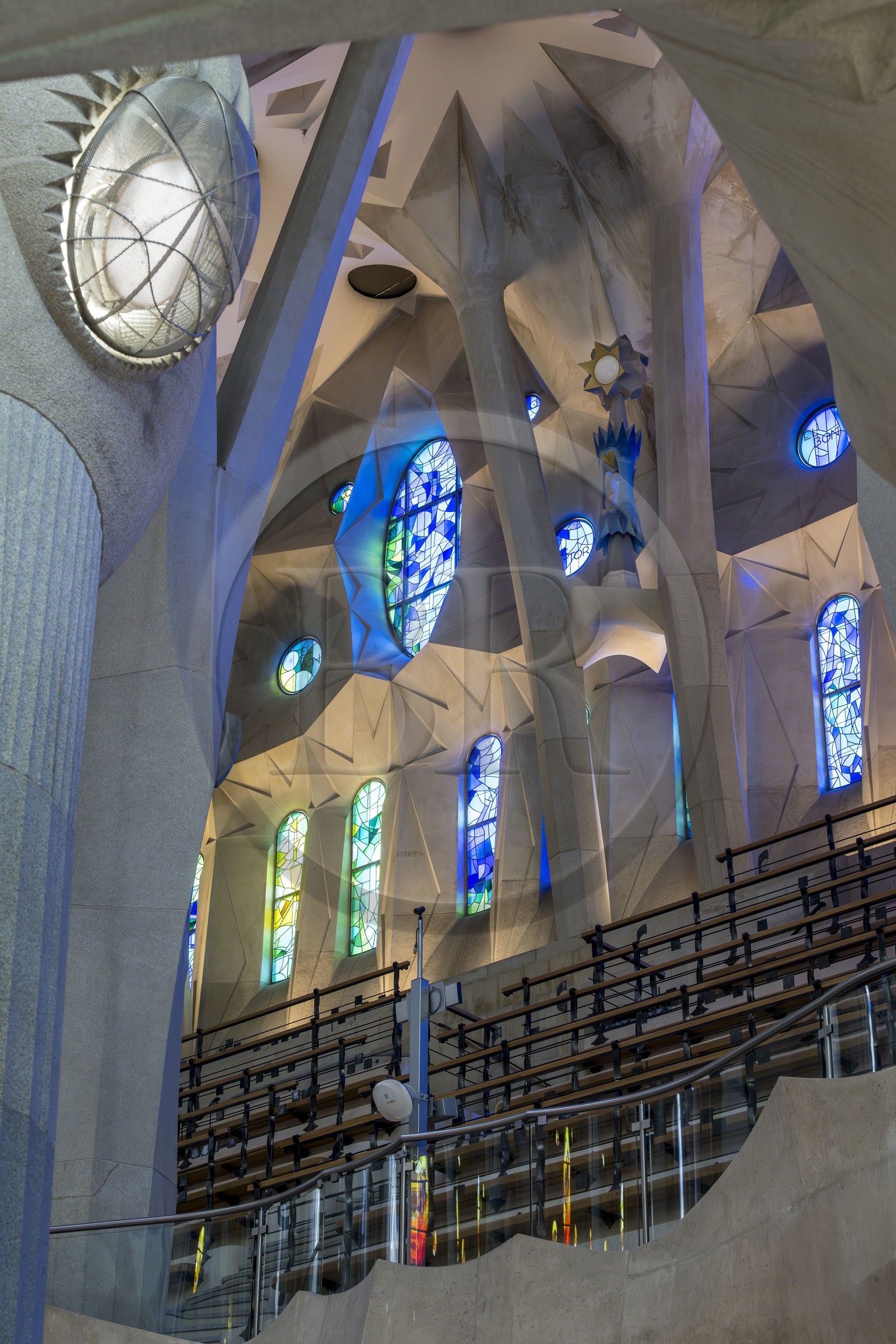 Spain, Catalonia, Barcelona, Eixample district, Sagrada Familia basilica by Catalan modernist architect Antoni Gaudi, listed as a UNESCO World Heritage Site, the east side of the Nave and the bins designed to accommodate large choirs, the columns of the central vessel (nave) are subdivided into branches like a tree