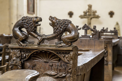 France, Yonne, Montreal (Burgundy), the 12th century Romanesque Notre-Dame collegiate church, Renaissance stalls in carved wood executed between 1530 and 1550 and donated by King Francois Ier, two lions face each other arguing over a bone