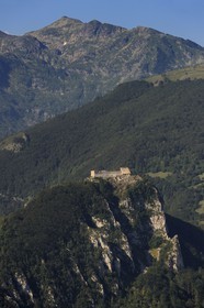 France, Ariege, Pays d' Olmes, Cathar Castle of Montsegur perched on a rock and the Pyrenees (aerial view)..