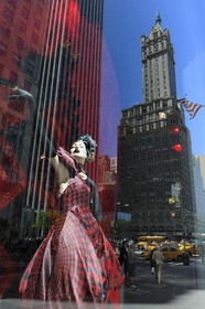 United States, New York, Manhattan, reflection of a skyscraper in a shop window dedicated to Alexander McQueen of the store Bergdorf Goodman on 5th Avenue